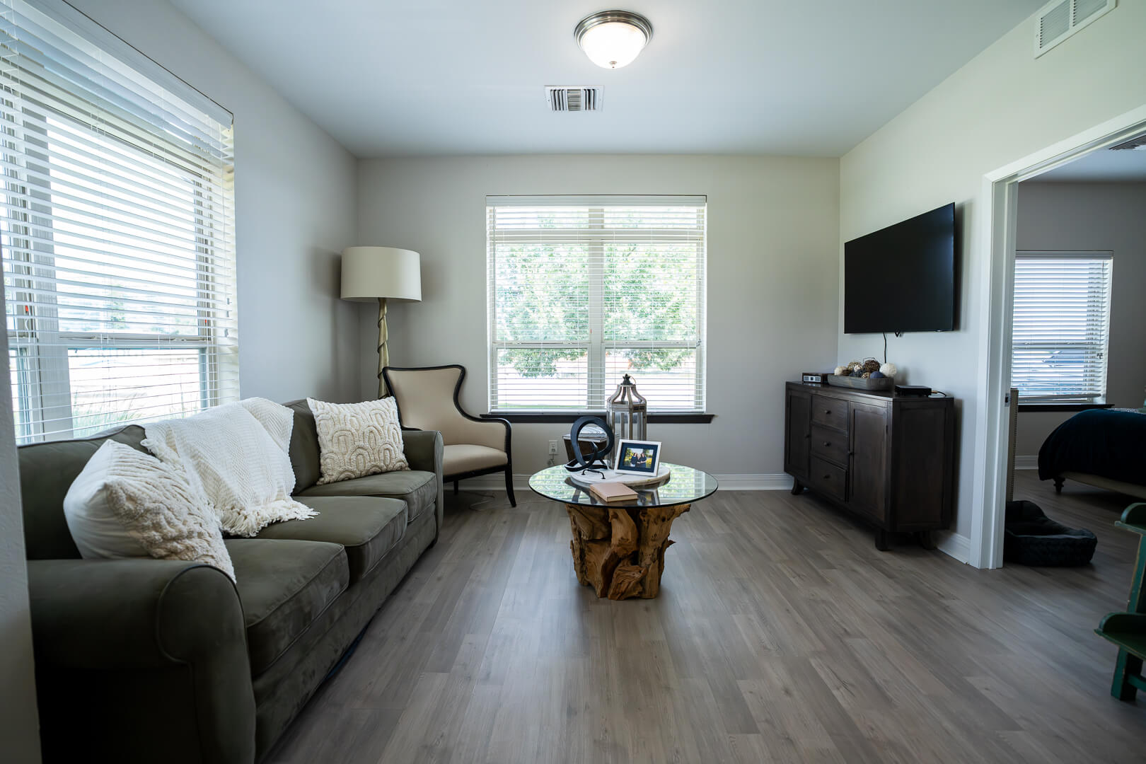 Private Resident Living Room With Modern Amenities at Memory Care Community
