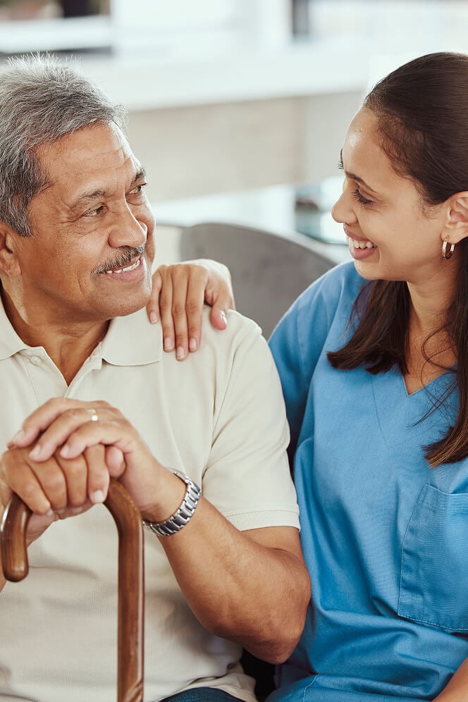 Nurse Comforting Elderly Woman at Nursing Home Oxford