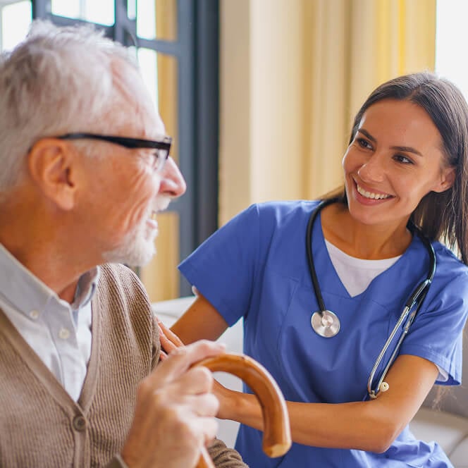 Caregiver Comforting Resident at Assisted Living Facility
